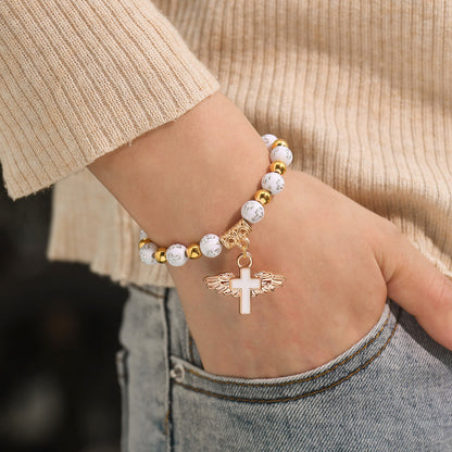 To My Granddaughter, Pray Through It Angel Wings Cross Bracelet (Set of 2)